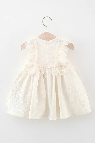 This adorable white dress with a little purse is a sweet addition to any girls kids clothing collection and aligns with current girls fashion.