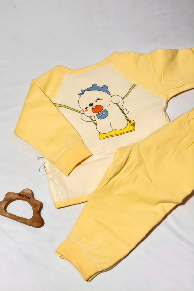 Yellow long-sleeve shirt with cartoon character on a light gray background