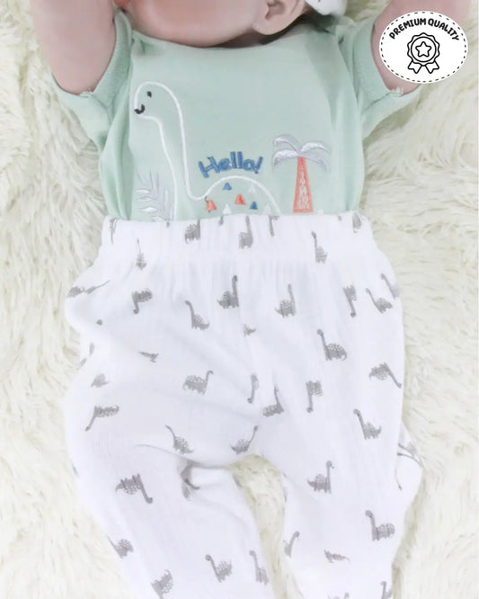 Girls kids clothing set featuring a mint green short-sleeve onesie with a dinosaur print, white pants with small dinosaur patterns, and a matching white bib. Perfect for girls' fashion and trending clothes for girls
