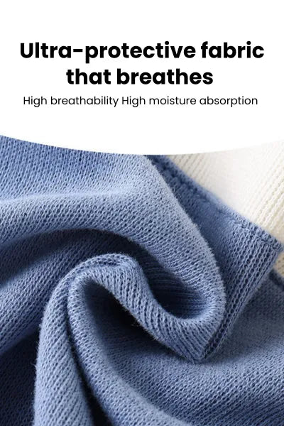 A close-up shot of a soft, textured blue fabric, described as "Ultra-protective fabric that breathes" with "High breathability" and "High moisture absorption."