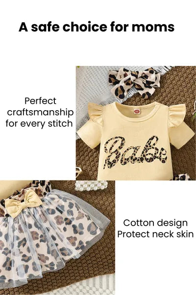 Trending clothes for girls: A stylish set of new born cloths including a "Babe" bodysuit, leopard print skirt with tulle, matching headband, shoes, hat, and tiny purse, showcasing current girls fashion.
