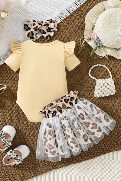 This set of new born cloths presents a trendy look for girls, with a "Babe" slogan bodysuit, animal print skirt, and coordinating accessories, all within current girls fashion.
