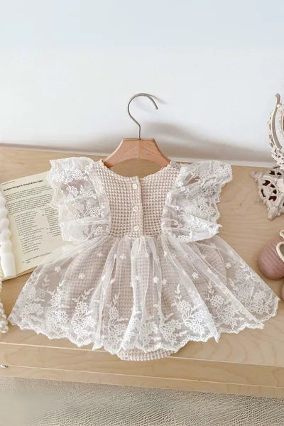 Girls kids clothing: A stylish and delicate lace romper, reflecting the latest trends in girls fashion