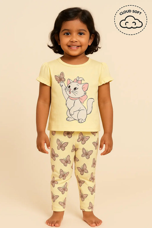 "Girls kids clothing featuring a young girl wearing a yellow outfit with a cute cat print on the top and butterfly prints on the pants. Girls fashion, girls wear, trending clothes for girls."
