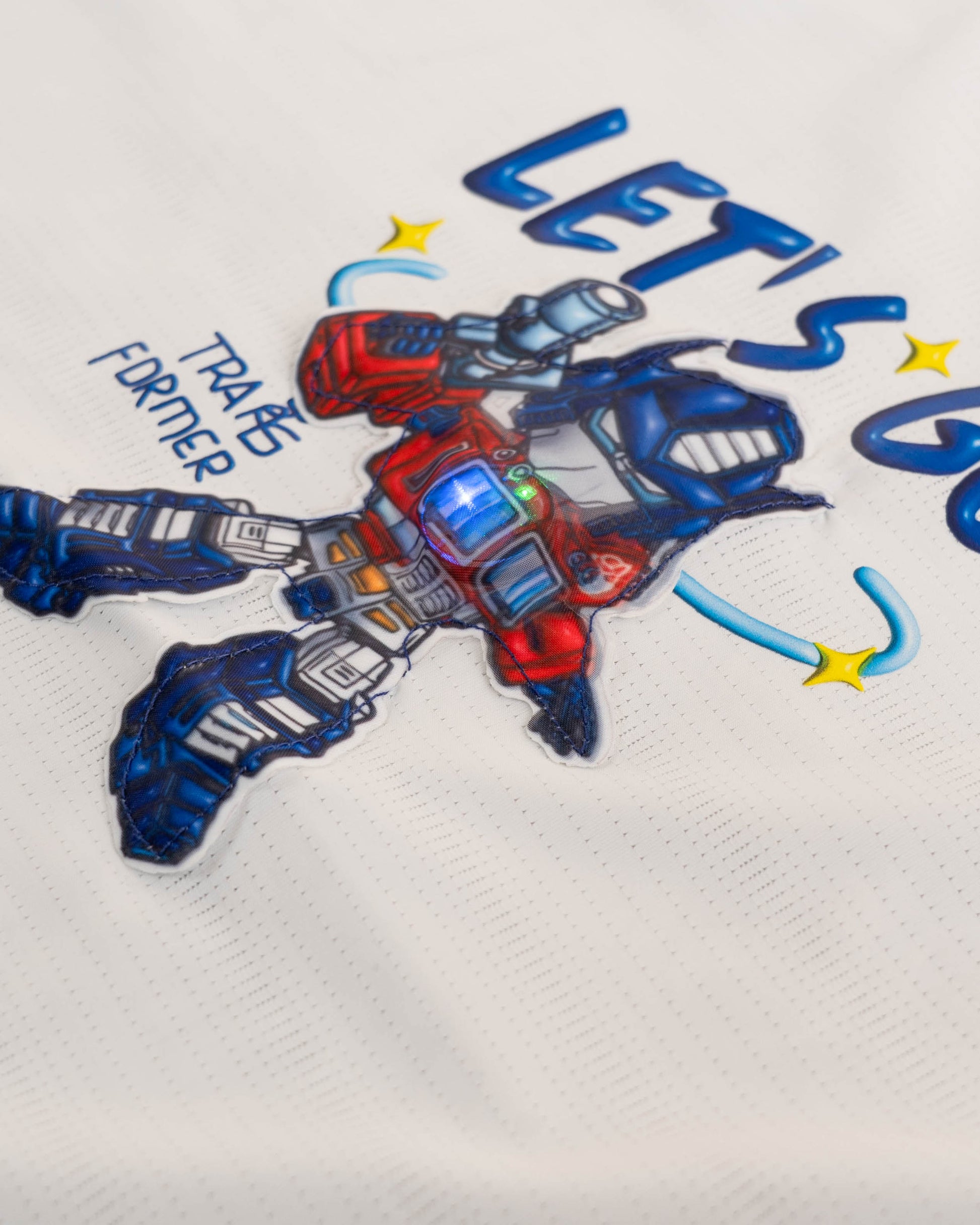 Kids dress for boys: a white t-shirt with a "LET'S GO!" and Optimus Prime design