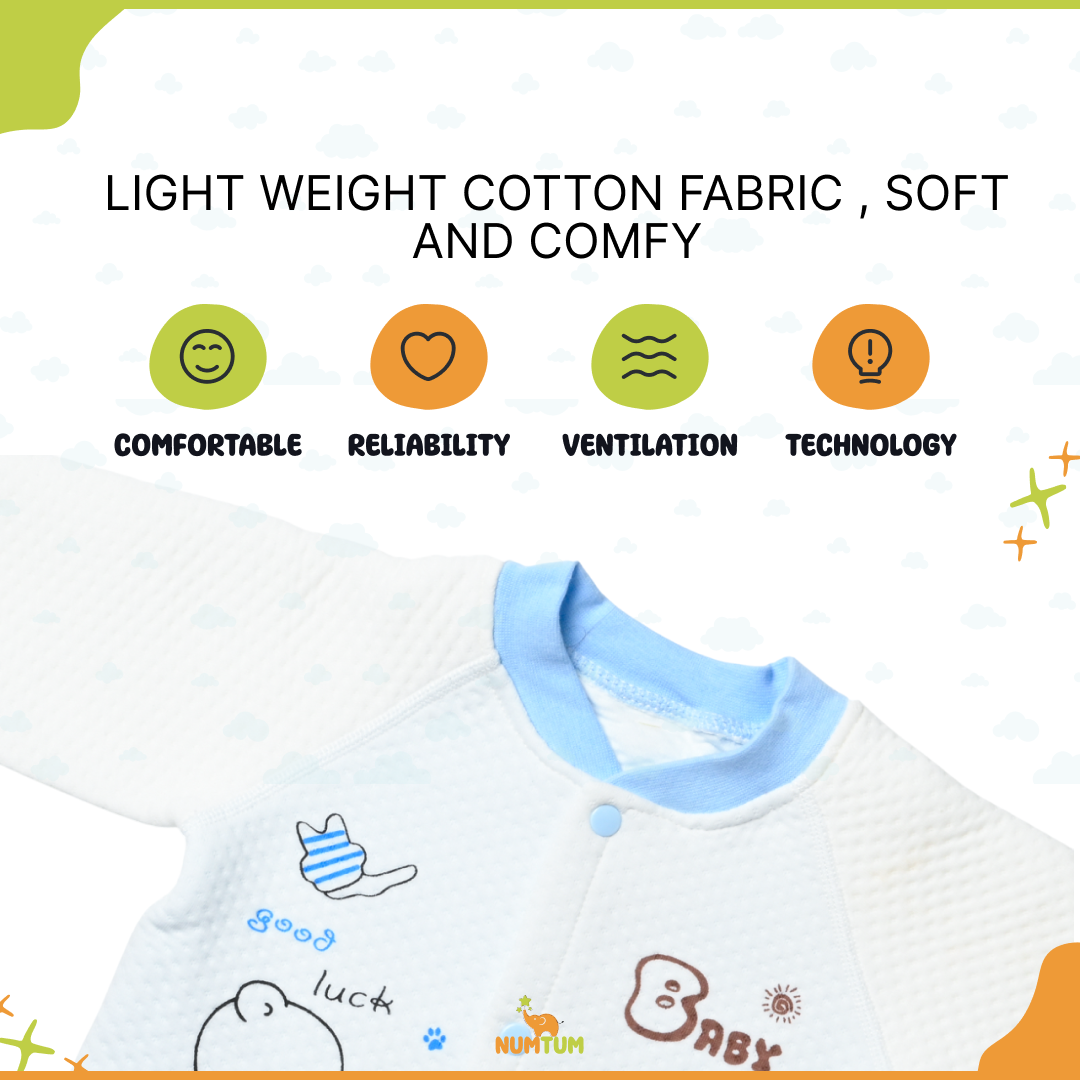 A young boy smiles while wearing a grey and yellow pants set - boys pyjamas featuring a Garfield print