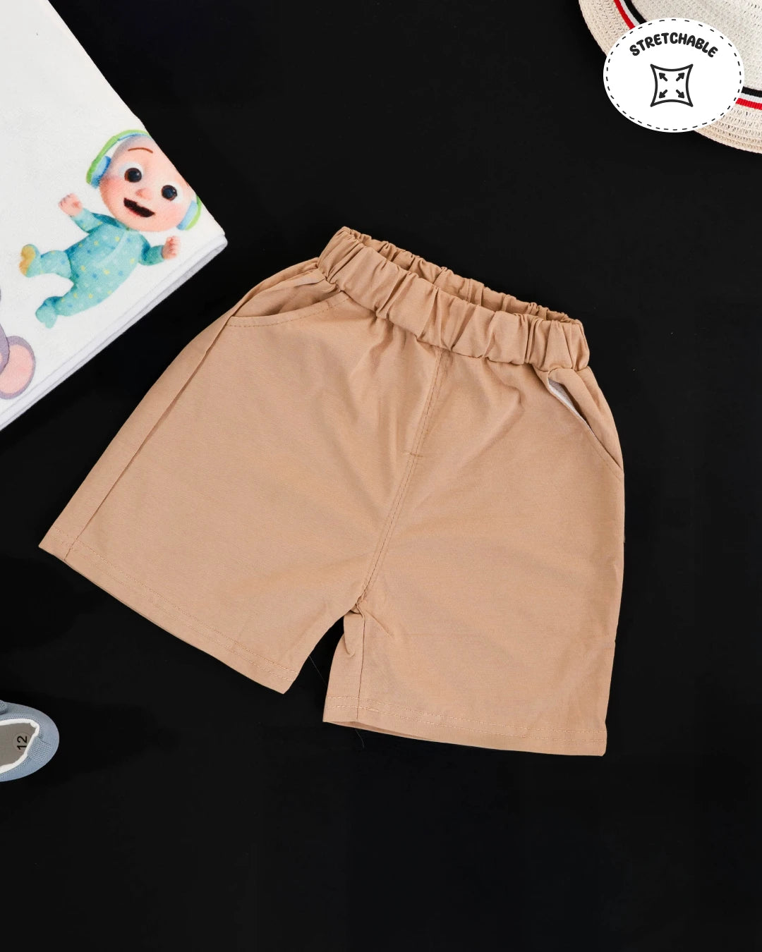 Boys dress style: matching set of tan shorts and an owl-patterned button-up top. Kids clothes boys, kids dress for boys