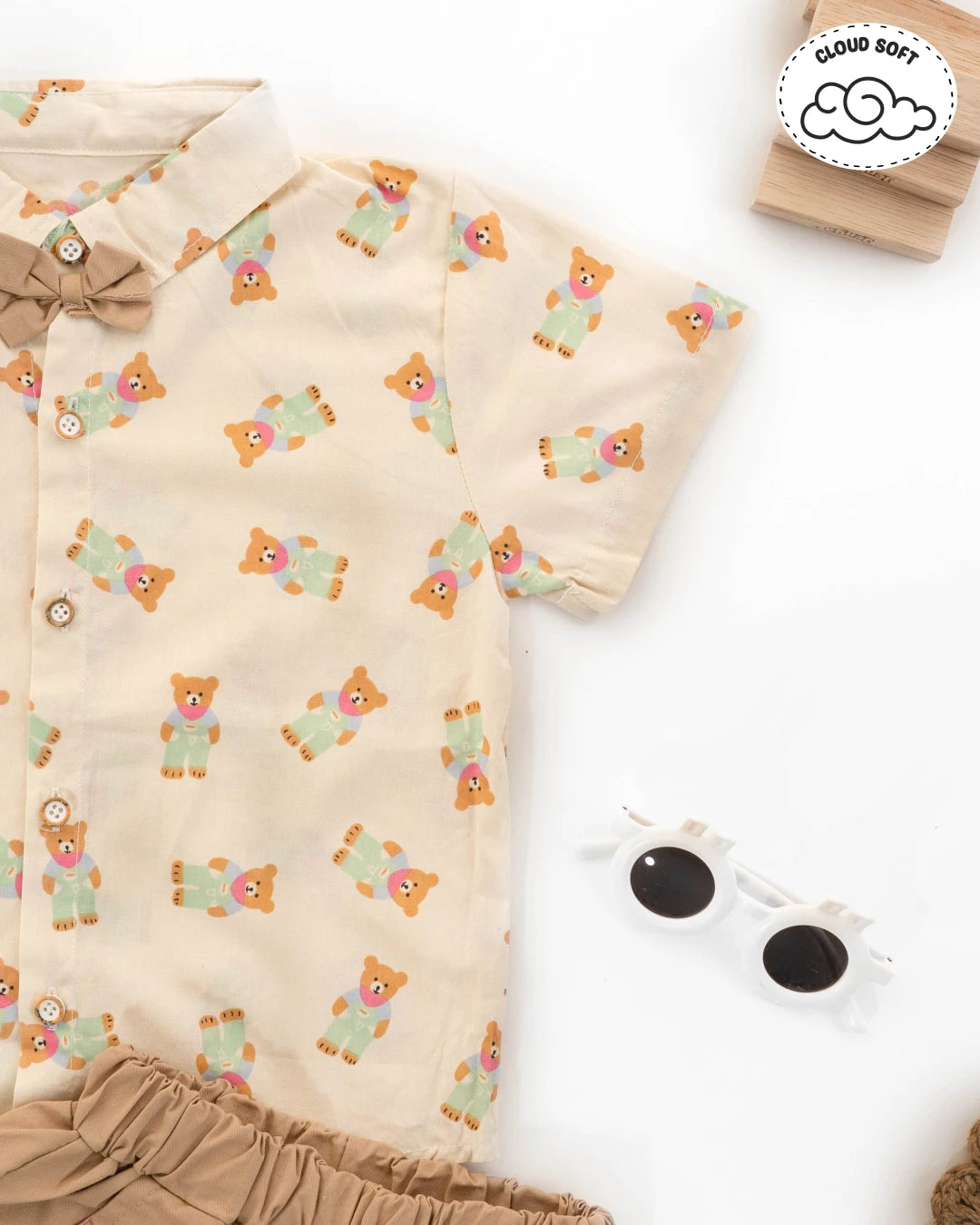 Boys new dress: fashionable outfit featuring beige shorts and a printed shirt. Kids clothes boys, boys dress