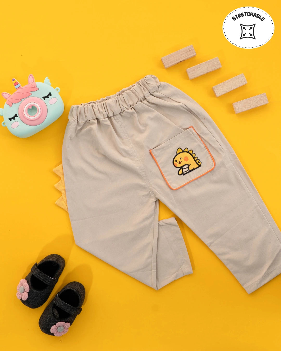 Boys dress: light blue t-shirt paired with mustard-colored shorts. Kids clothes boys, boys dress style