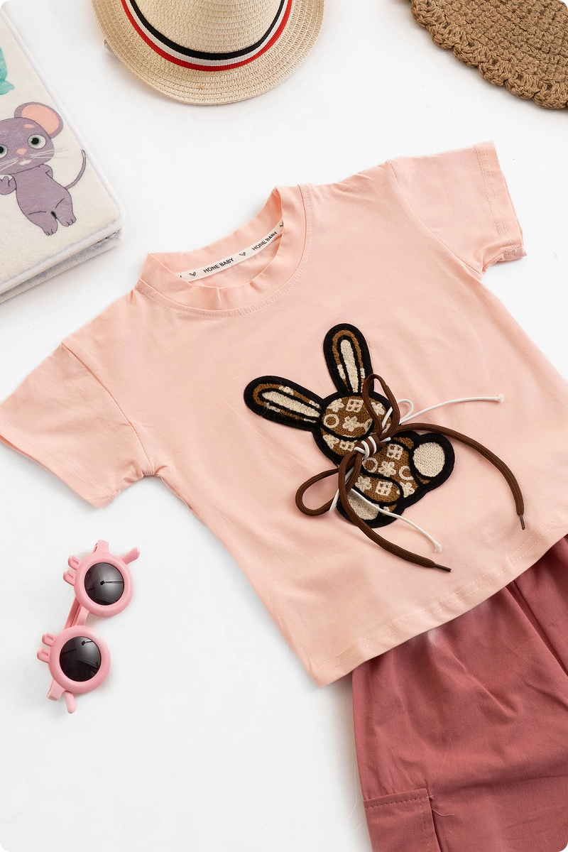 Cute girls fashion outfit with a bunny design top and stylish cargo pants. Girls kids clothing, girls wear, trending clothes for girls