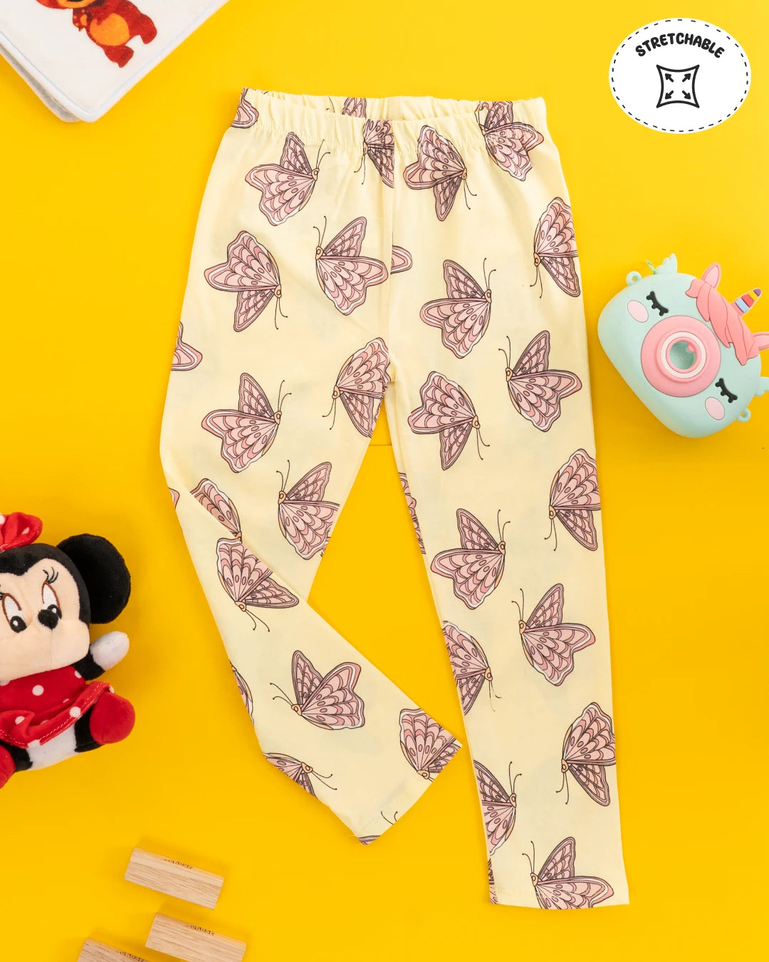 Girls wear set including a yellow t-shirt with ruffled sleeves and matching leggings, both adorned with butterflies. Girls kids clothing, girls fashion, trending clothes for girls