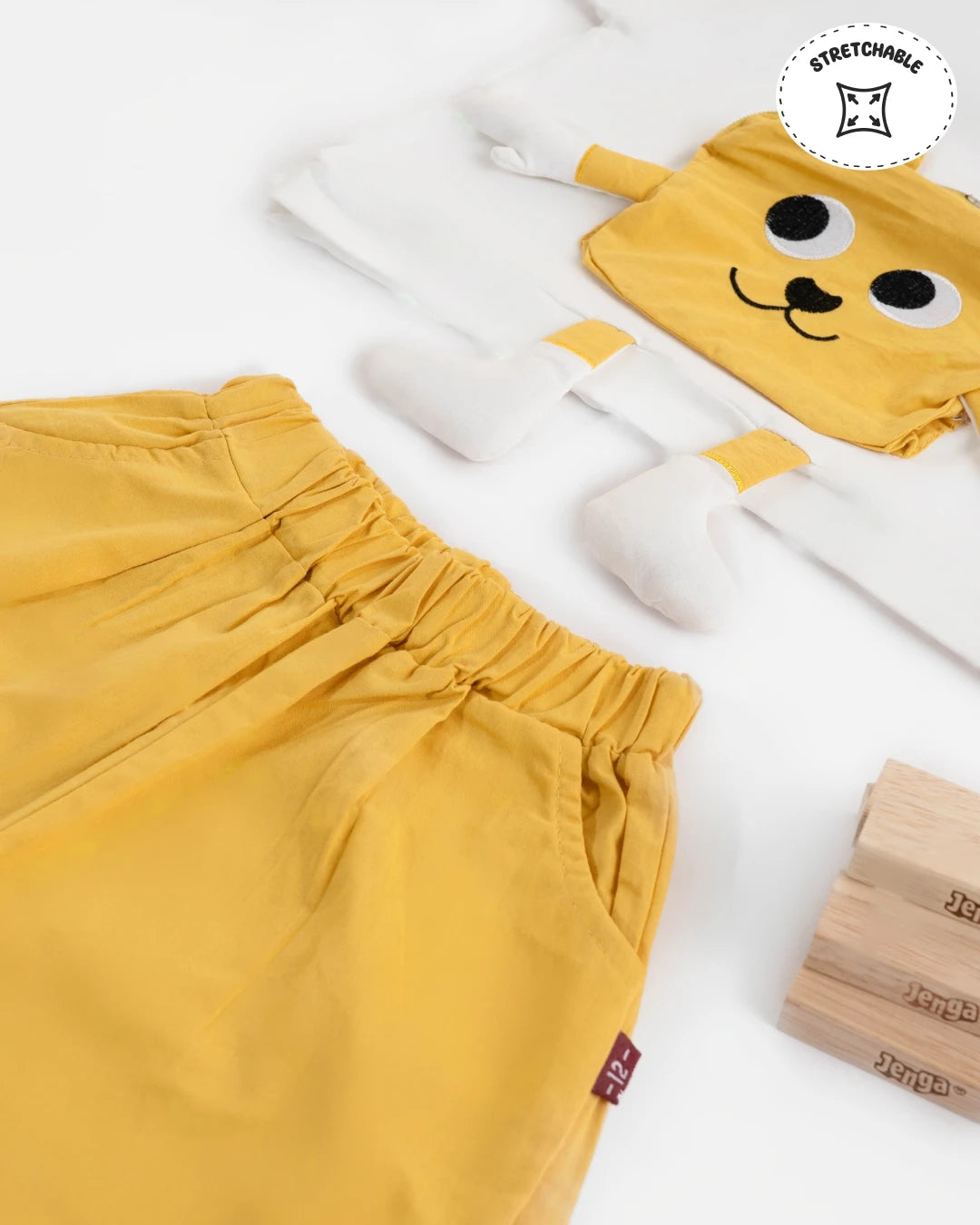 Boys new dress: fresh summer outfit with a white t-shirt and yellow shorts. Kids clothes boys, boys dress