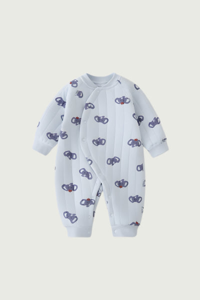 Baby onesie with elephant pattern on a light gray background