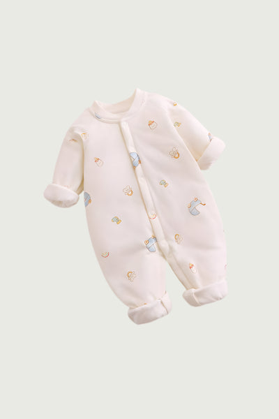 Baby onesie with small patterns on a light gray background