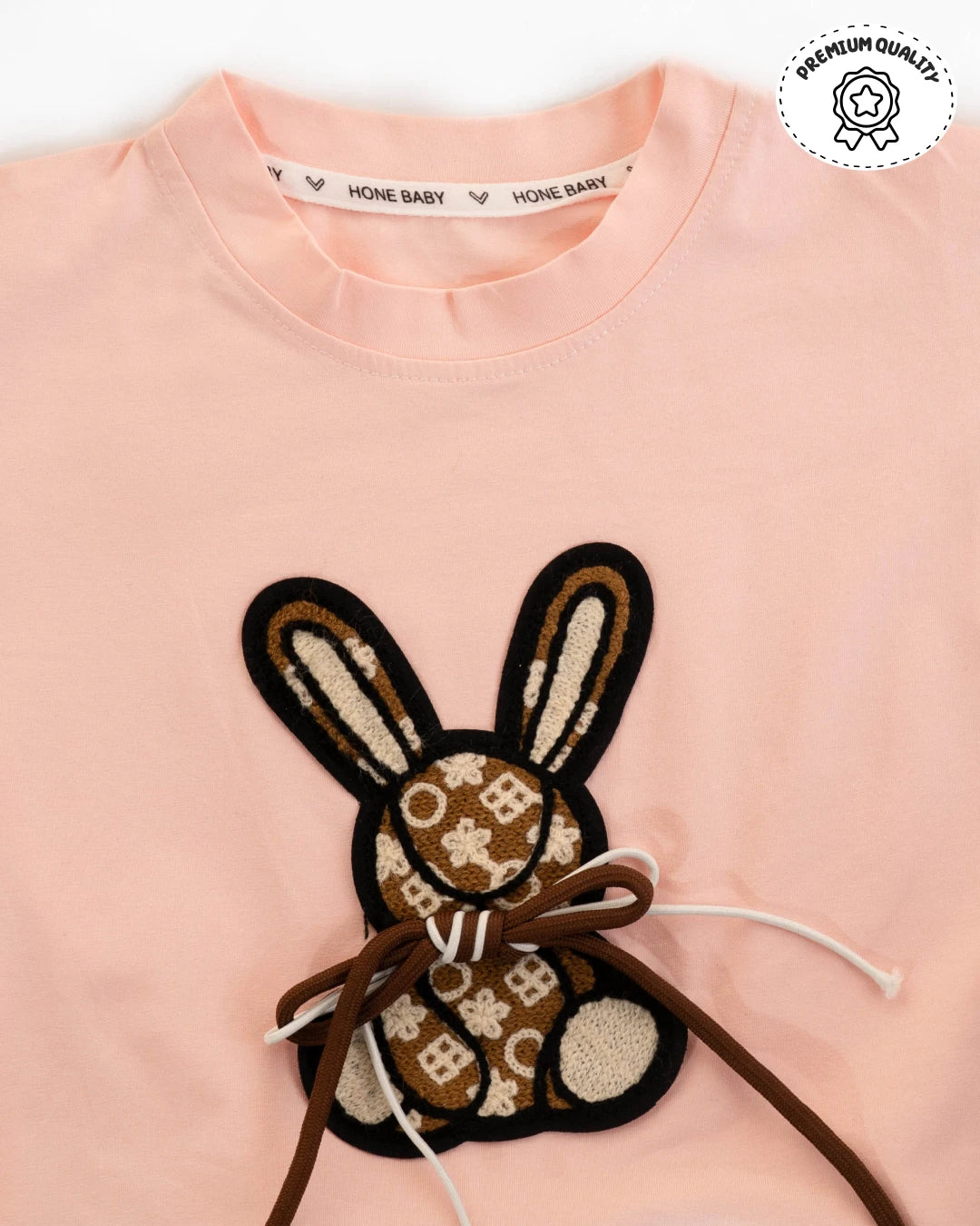 Trending clothes for girls: soft pink t-shirt with bunny design and matching cargo pants. Girls kids clothing, latest fashion for girls