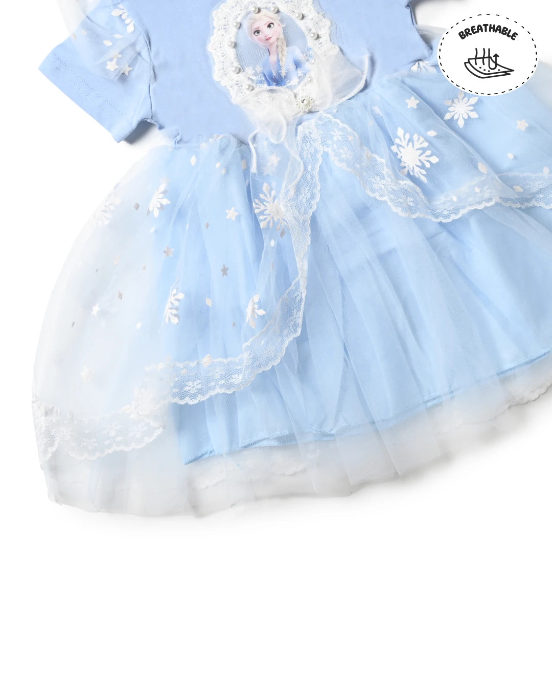 Trending clothes for girls featuring a blue dress with tulle overlay. Girls kids clothing, girls fashion